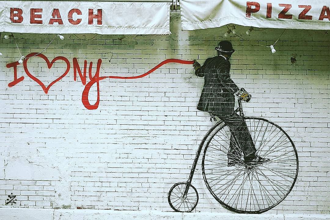 Who doesn't love New York while graffiti-ing, penny-farthing, and eating pizza? . . .